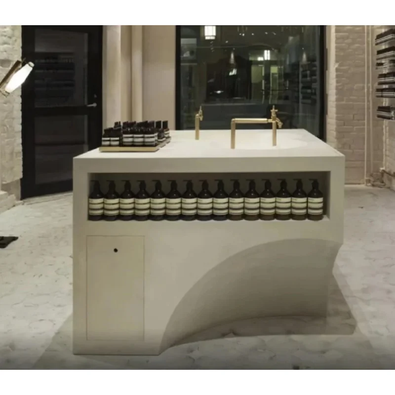 custom.Minimalist Microcement Island Counter High-End Custom Beauty Bar with LED Lighting and Brass Fixtures Fragrance