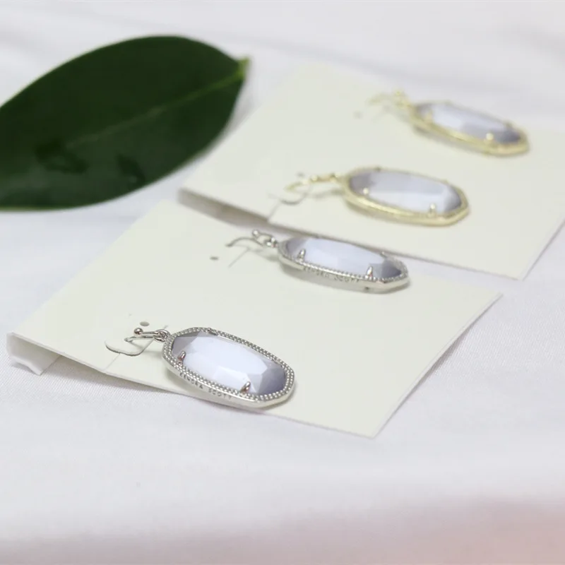 

Europe and the United States niche oval temperament earrings Dani gray cat's eye stone head fashion earrings geometric earrings