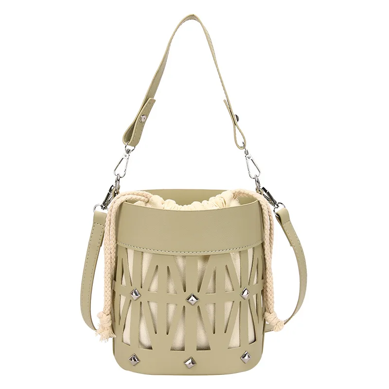 Bolso de hombro de PU hueco de diseño Popular de este año para mujer, bolso de mensajero portátil, bolsos de cubo, versión coreana de moda pura de verano