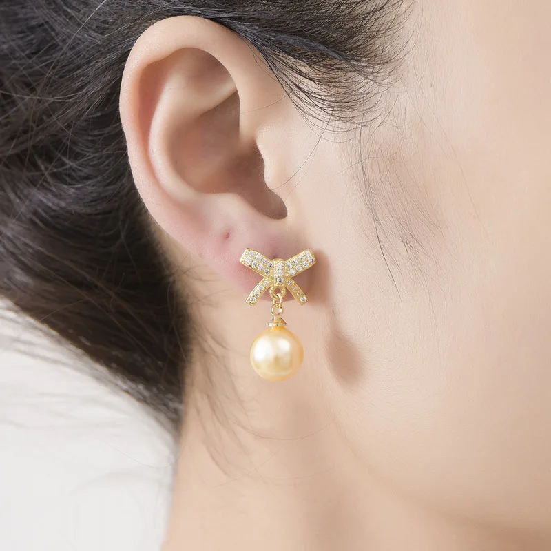 Korean-style realistic imitation natural freshwater pearl with full diamonds and bow-shaped earrings for sensitive ears - women'