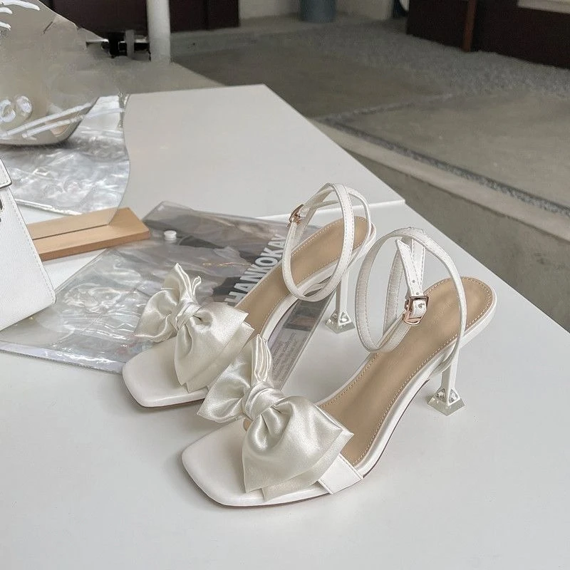 

Fairy Core Sandals Women 2026 Spring Summer White Bowknot Square Toe Single Strap Dress High Heels​