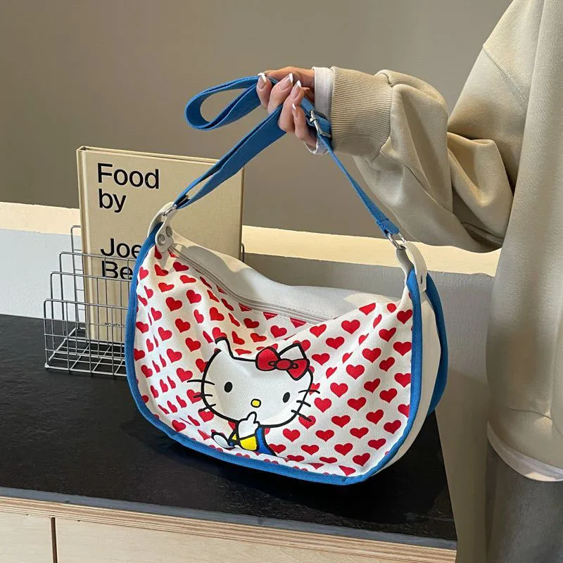 2024 New Sanrio Hello Kittys borsa di tela simpatico cartone animato stampa a schermo intero ragazza cuore Casual Versatile borsa a tracolla giocattoli regali per ragazza