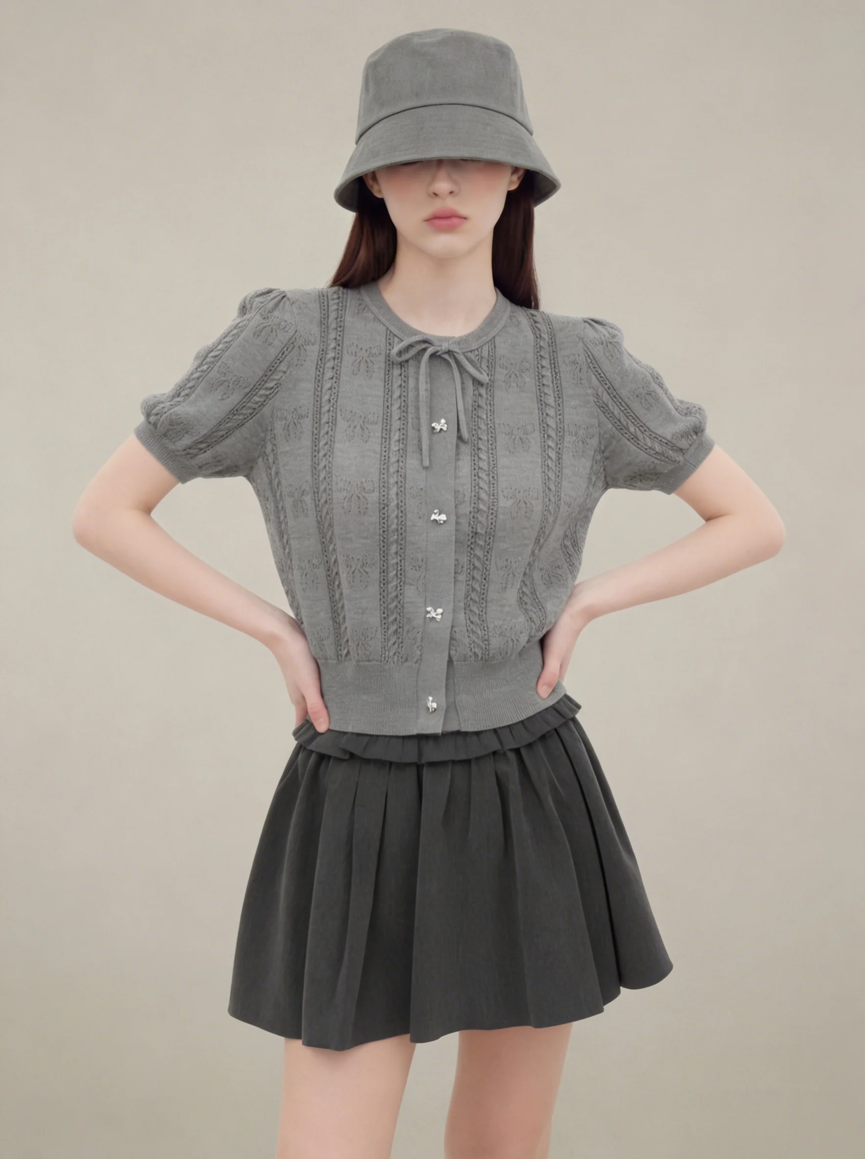 

Gray Knitted Top with Bow Tie Hollow out Design And Matching Short Skirt Women's Fashion Set Casual Style Spring Collection