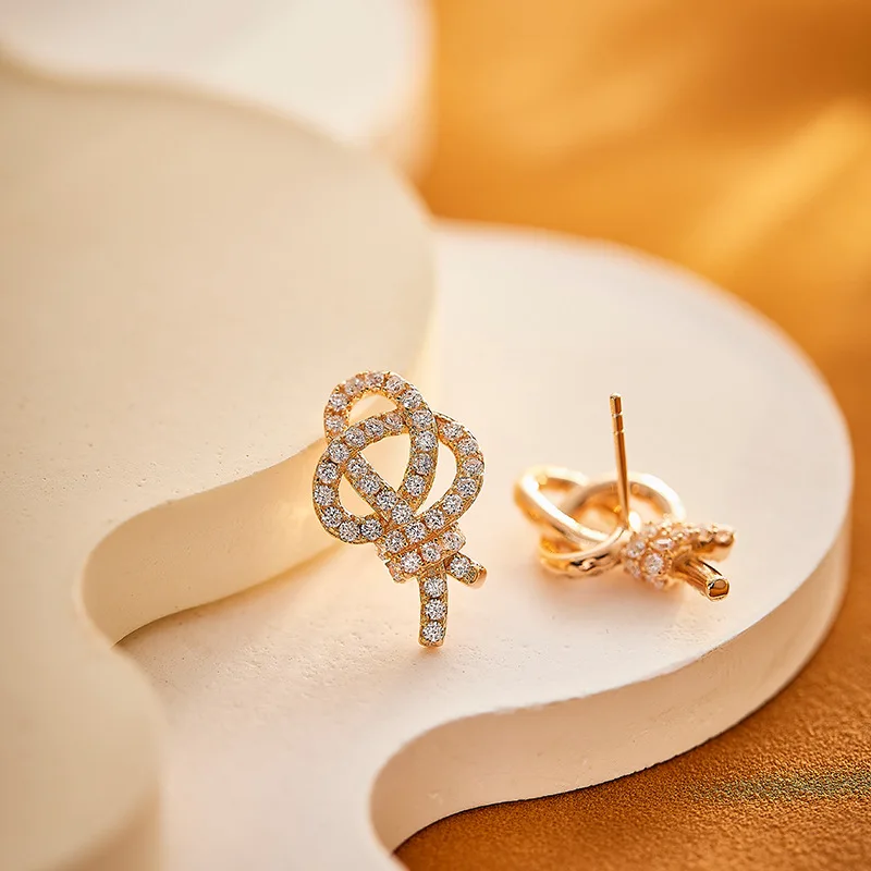 

Key Ear StudsS925Silver-Plated Colored Gold Simple Fashion Star Hollow Ribbon Bends and Hitches Earrings