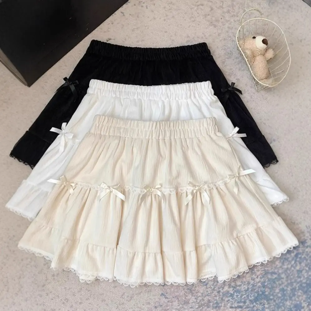 Minigonna corta da ragazza a vita alta con pantaloni di sicurezza Gonna a trapezio con fiocco con volant Abito da torta Minigonne a pieghe in pizzo allentato Lady