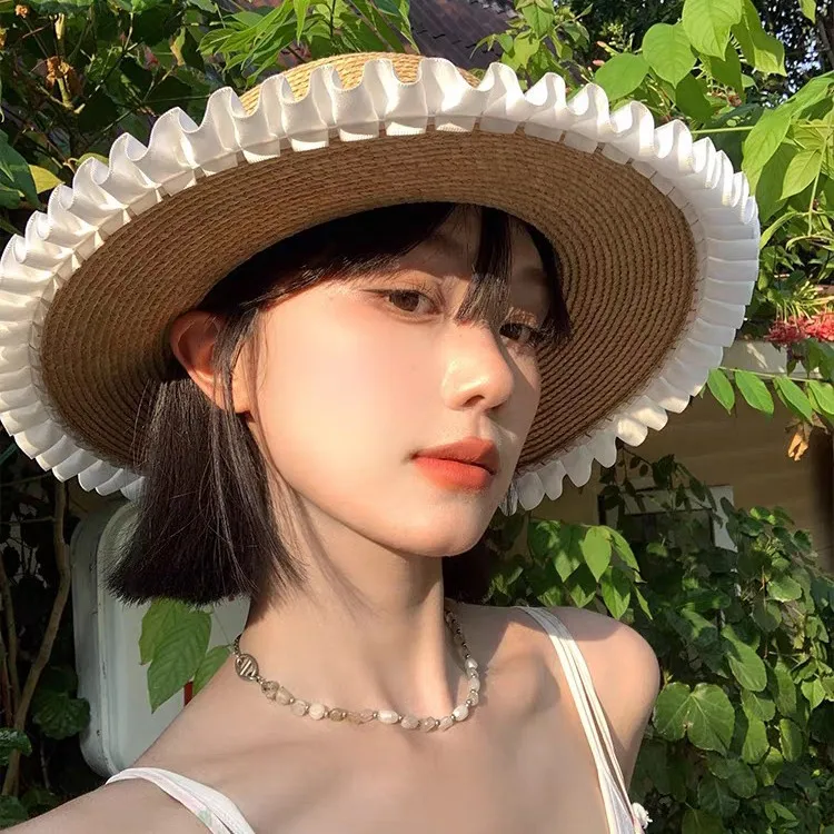 原宿女性麦わら帽子ビーチサンハット甘いロリータかわいいプリンセスリボン花レース弓麦わら帽子女性手作り