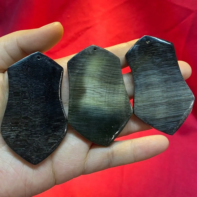 Black donkey hoof pendant carved from polished material a DIY accessory featuring a bagua (heavenly diagram) design