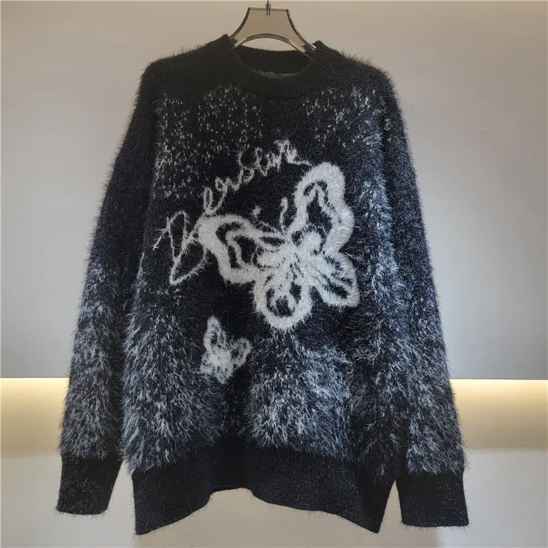 

Vintage-inspired black knit sweater. Features an oversized, slouchy fit and incredibly soft, cozy fabric.