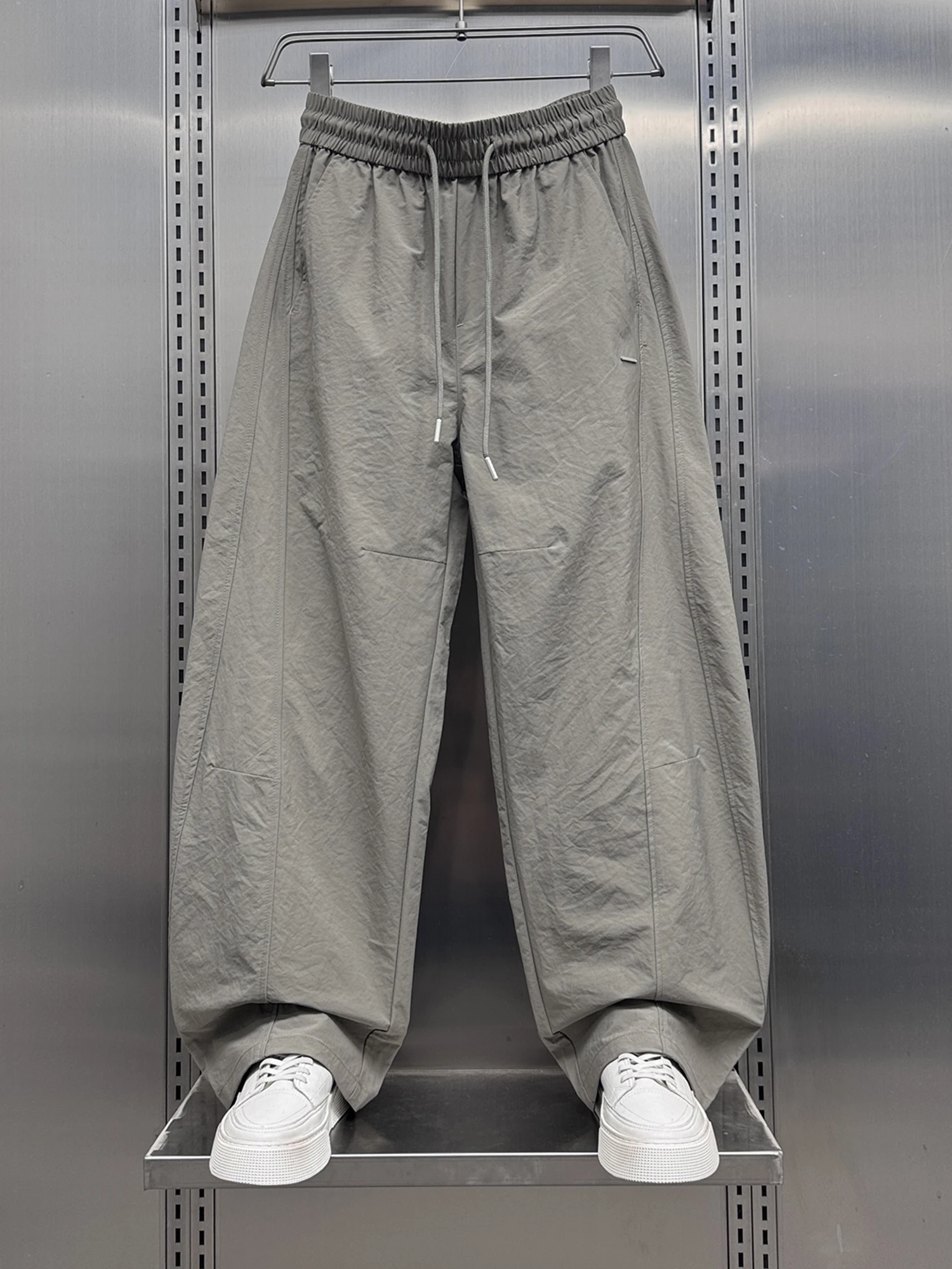 

Летние модные повседневные брюки 2025 года для мужчин: широкие, свободные, удлиненные, с дизайном «нож», молодежные, энергичные, тонкие, эластичные...