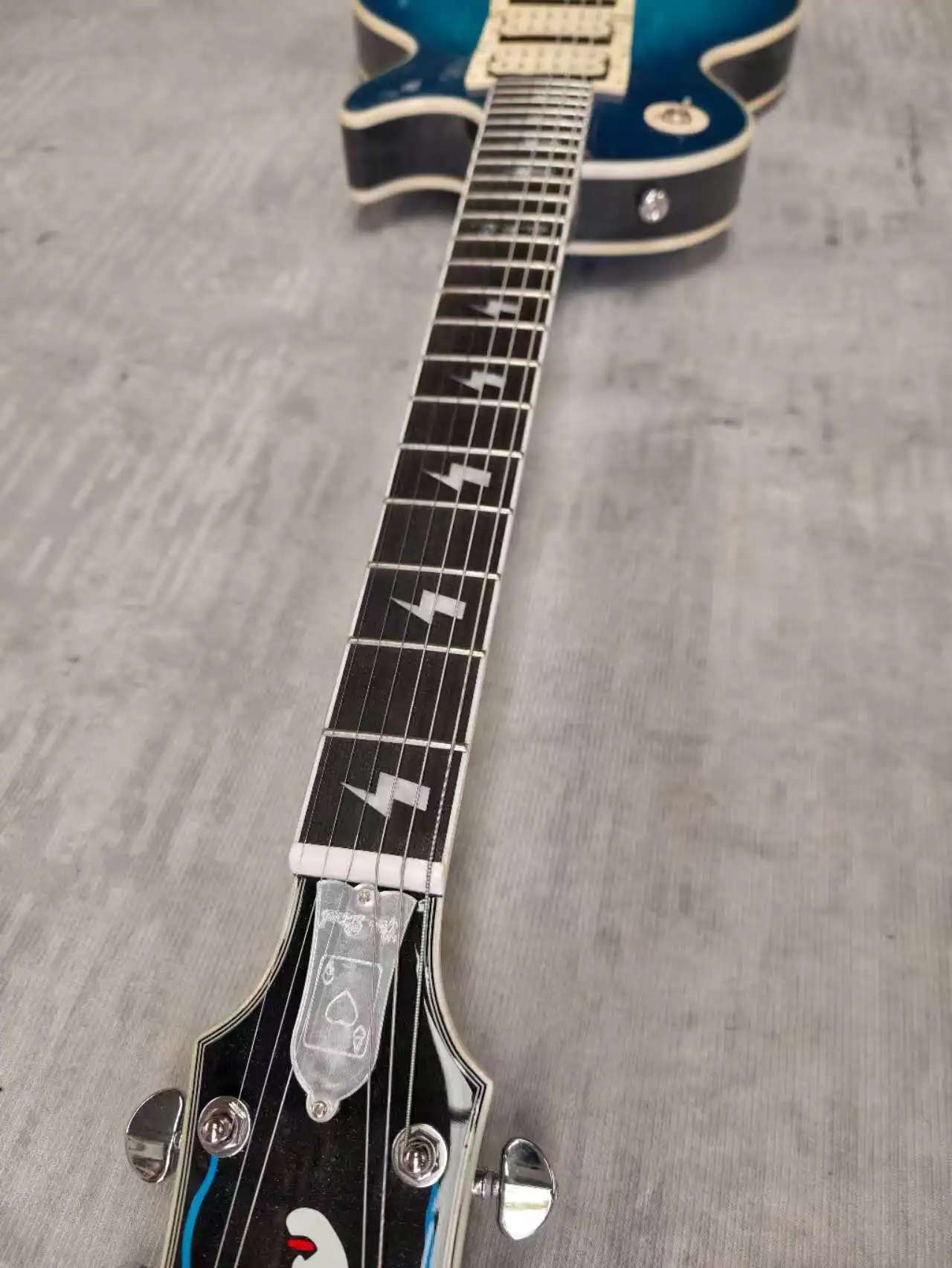 

Electric guitar made in China, flame maple. Blue 12F different