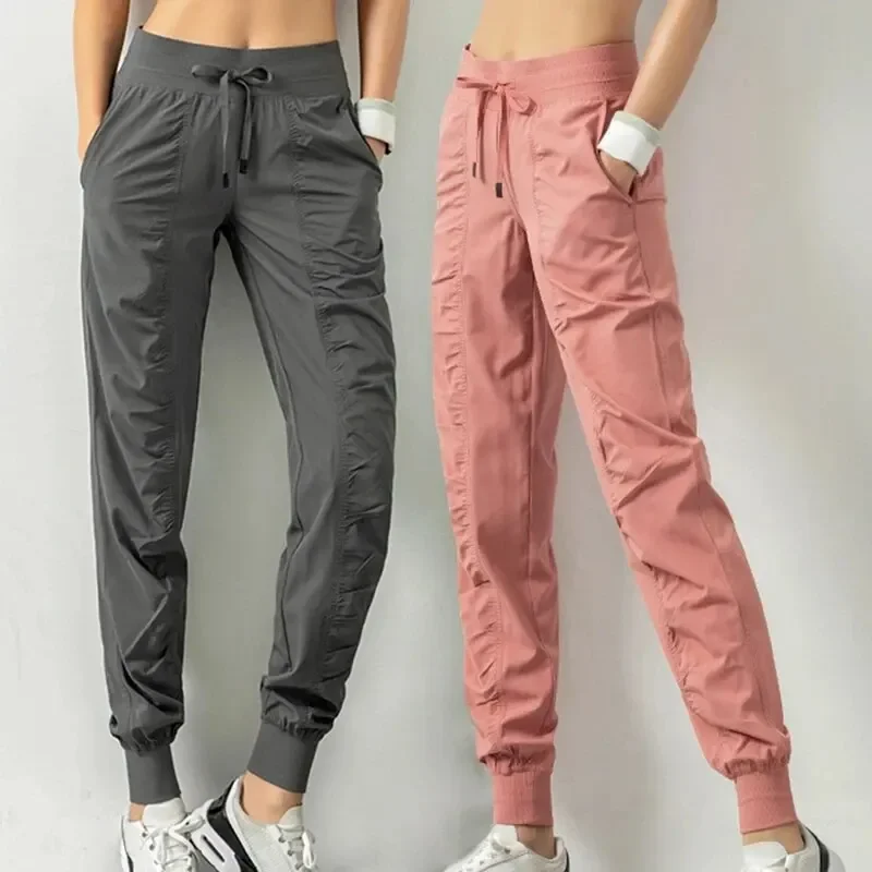 Pantaloni sportivi da corsa con coulisse in tessuto Pantaloni sportivi da donna per palestra atletica ad asciugatura rapida con due tasche laterali Pantaloni da esercizio