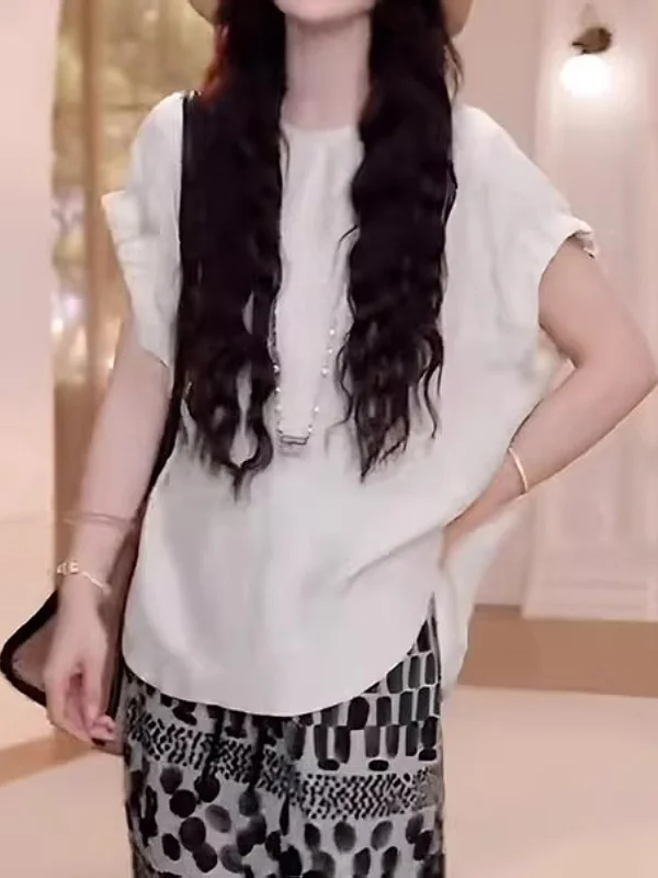 Letnia koszulka damska plus size, luźny krój, cienka, zapinana na guziki, styl koreański, modelująca sylwetkę typu gruszka.