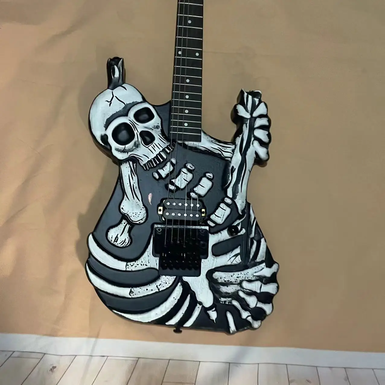 In stock, 6-chord skeleton carved electric guitar, matte black body, with authentic shipping pictures. Order and ship immediatel