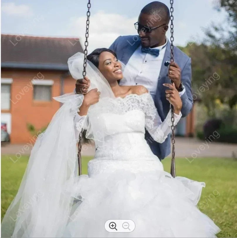 カスタマイズされた魅力的なオフショルダーアフリカ人魚長袖ウェディングドレス Vestido デ Casamento ティアードチュールブライダルドレス