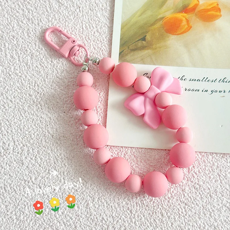 Pink pearl bow keychain, mobile phone chain, earphone bag, anti-lost rope, car keychain, beaded pendant, backpack pendant access