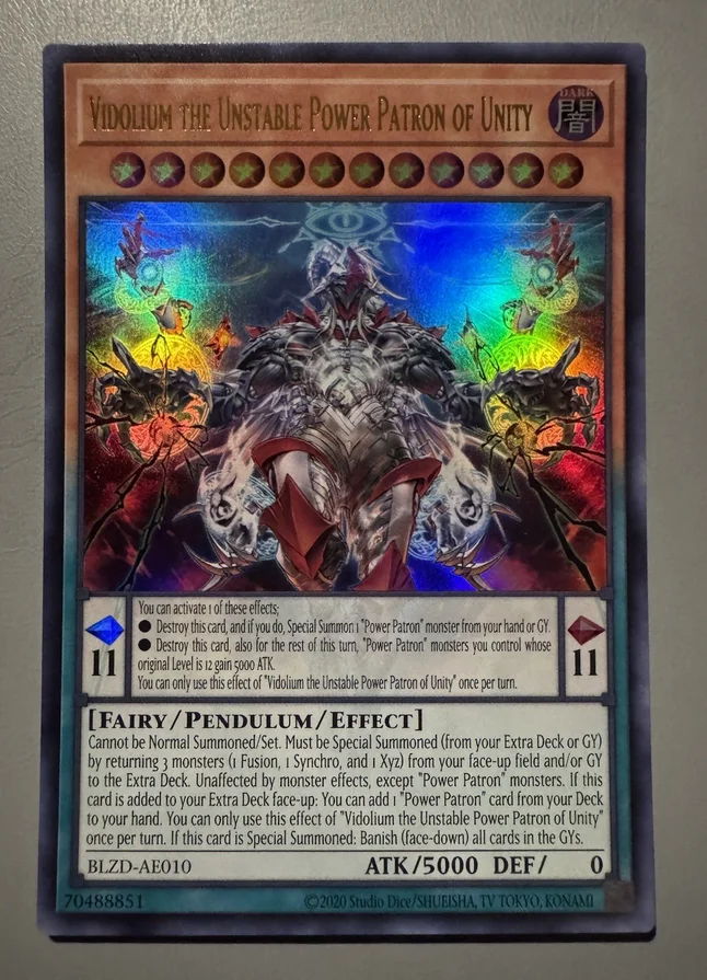 Yu-Gi-Oh KONAMI Monsters BLZD-AE010 Vidolium, le Protecteur de l'Unité à la Puissance Instable, Carte Ultra Rare de la Collection Anglaise Asiatique, État Neuf