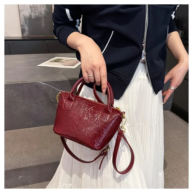 

Minimalist Designer Inspired Shoulder Bag With Leather Detail And Letter Logo Easily Serves As A Chic And Roomy Diaper Bag