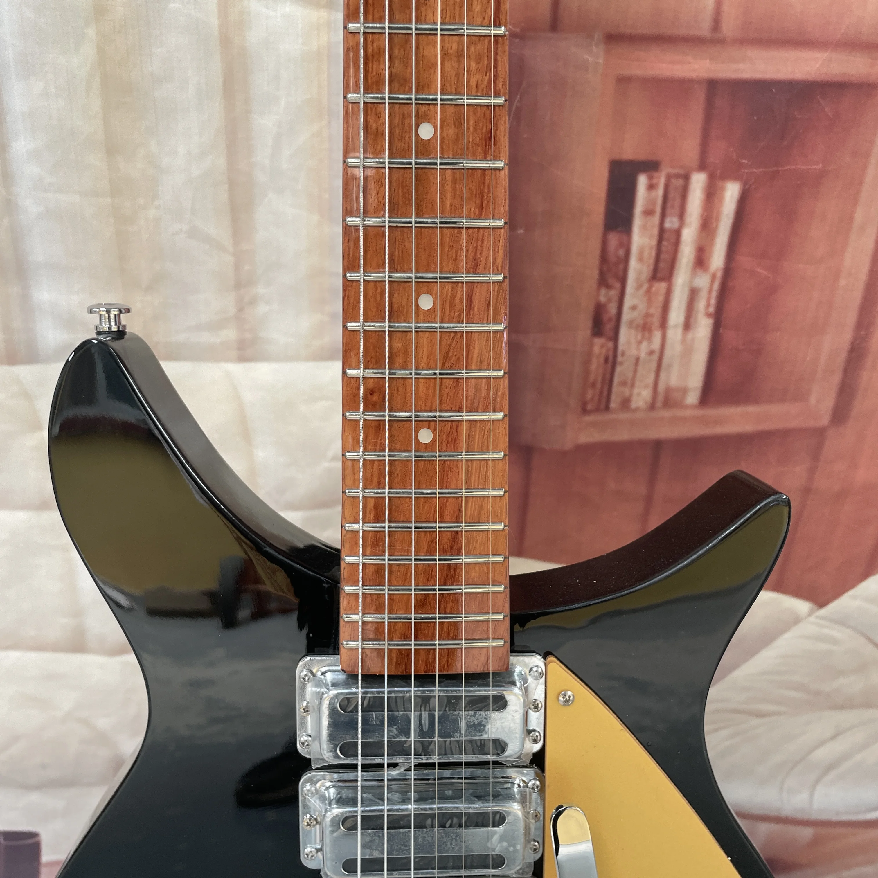 6-string electric guitar with a black glossy finish and retro gold fanned pickguard guitars, a vintage rock player's electric gu