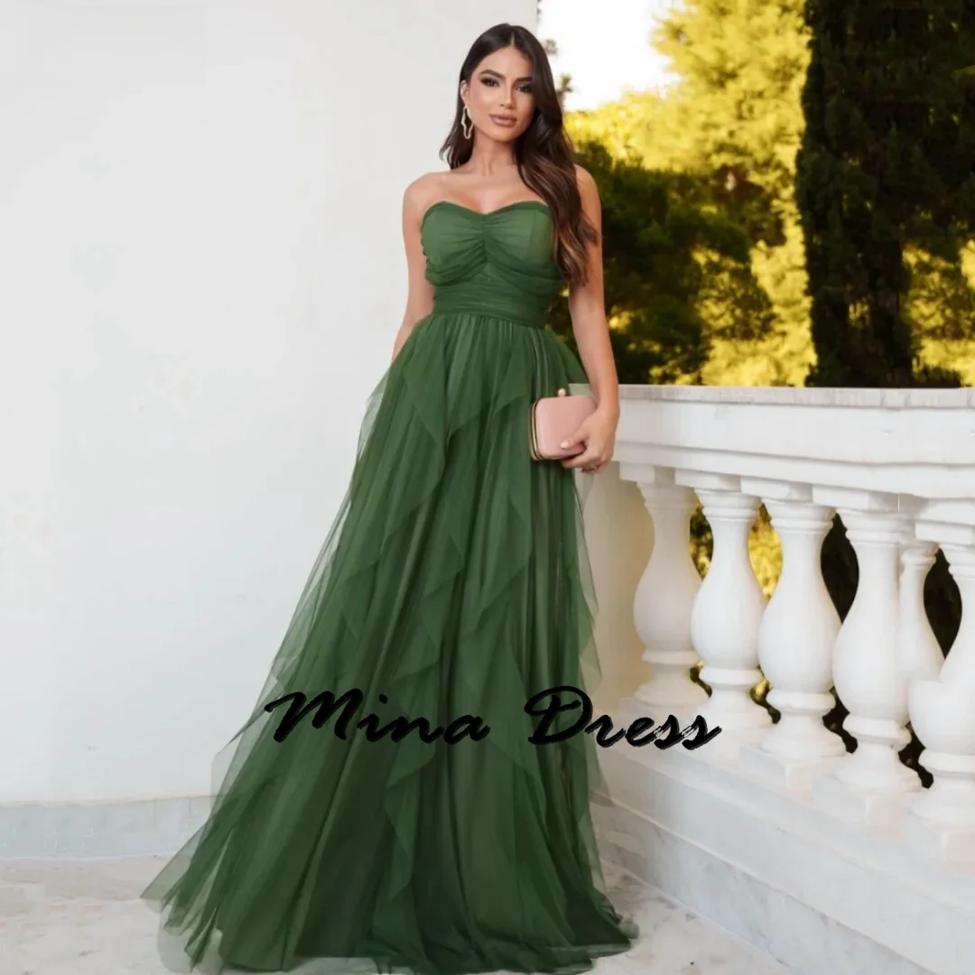 

Mina-2024-The green woman in the ball dress and the embroidered thin gauze evening dress are the sour é of the wedding gown for