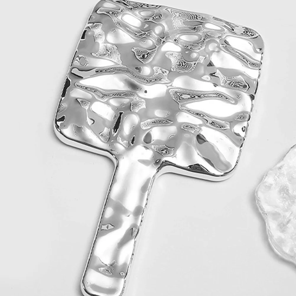 

Handheld Makeup Mirror Portable High-Definition Reflective Surface Electroplated Finish Stylish Accessory for Women Girls Silver