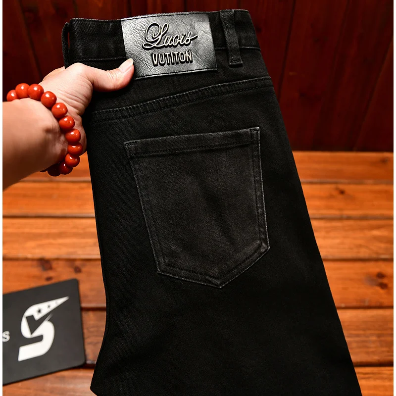 

High end black embroidered jeans for men in autumn, slim fit with small feet, trendy stretch print, Chinese ethnic style pants