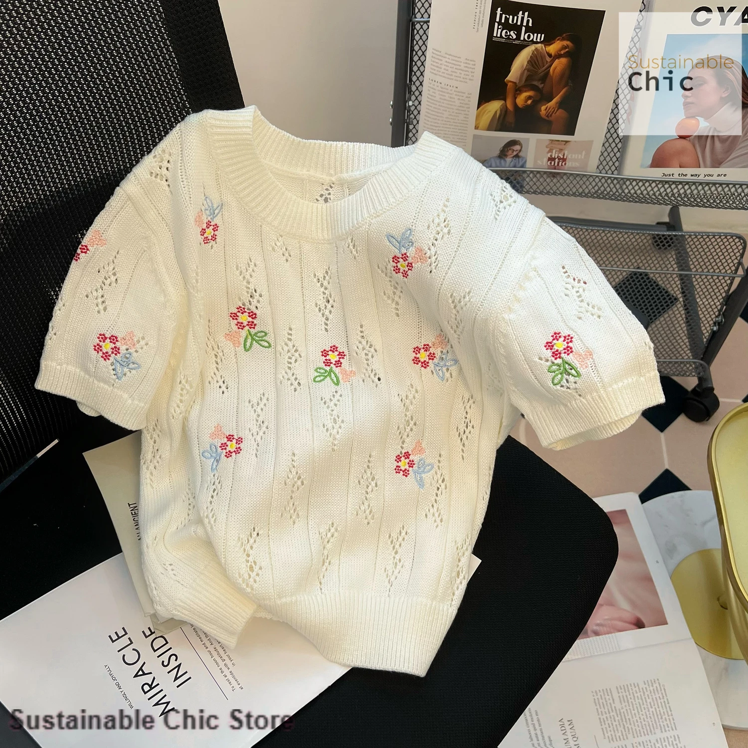 

Korean-style white small fragrance temperament flower hollow sweater women's spring and summer new niche design casual top