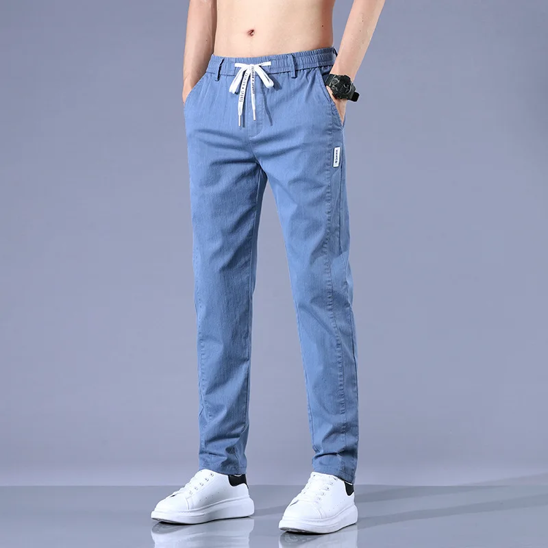 

Spring and Autumn Men's Elastic Waist Drawstring Small Pocket Pocket Solid Casual Denim Harlan Work Fashion Office Lady Pants