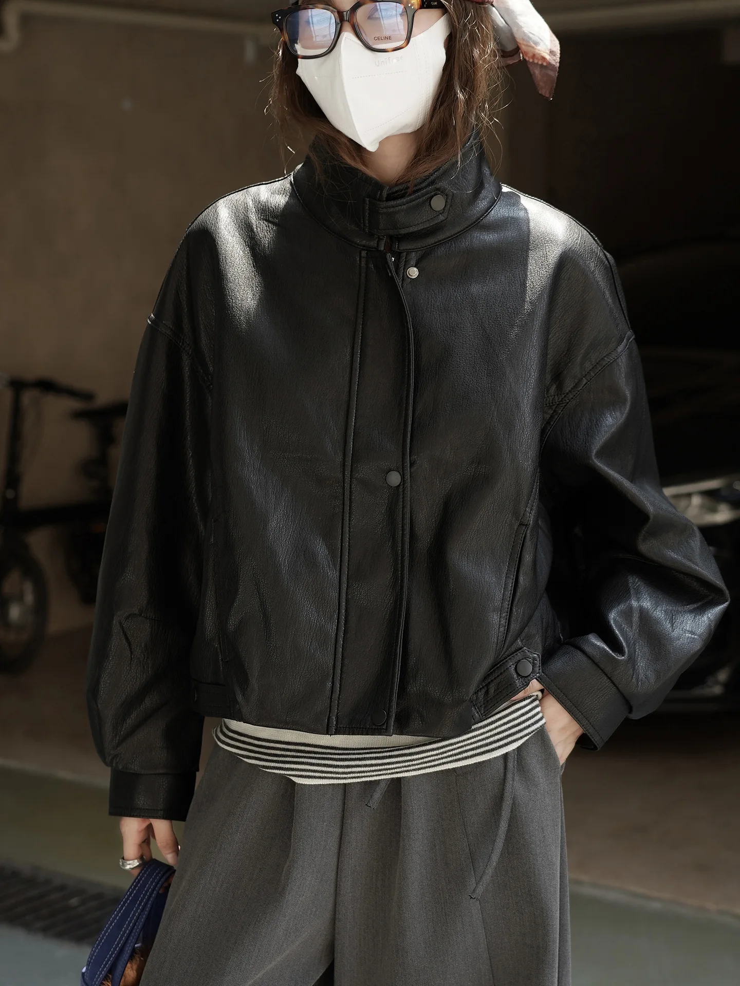 Fashionable and cool stand up collar split short jacket with a stylish silhouette design for women
