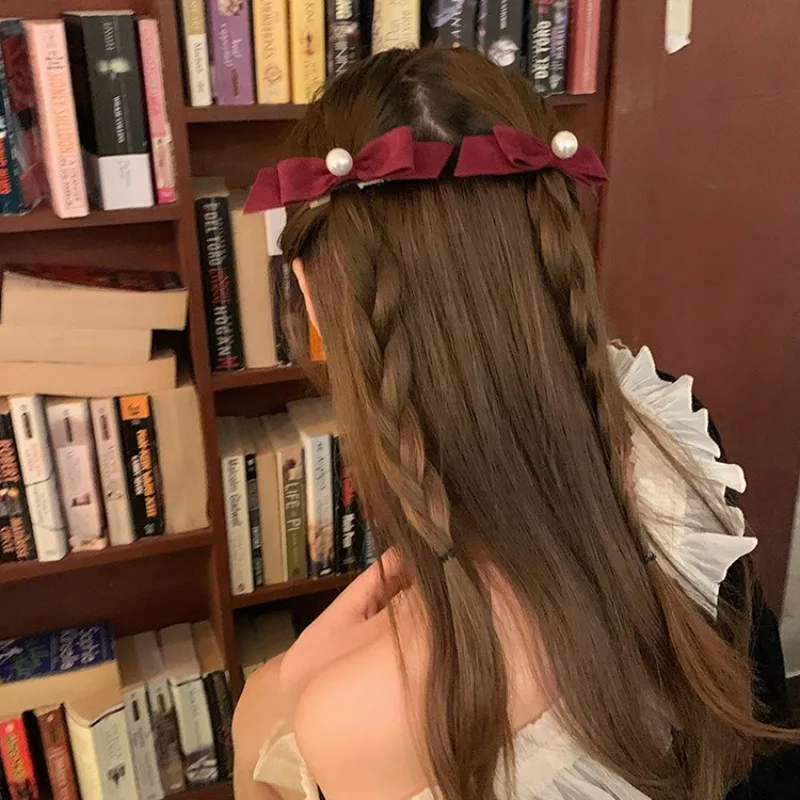 New Year's daughter Korean imported bow pearl temperament hairpin women's retro elegant black hairpin headgear