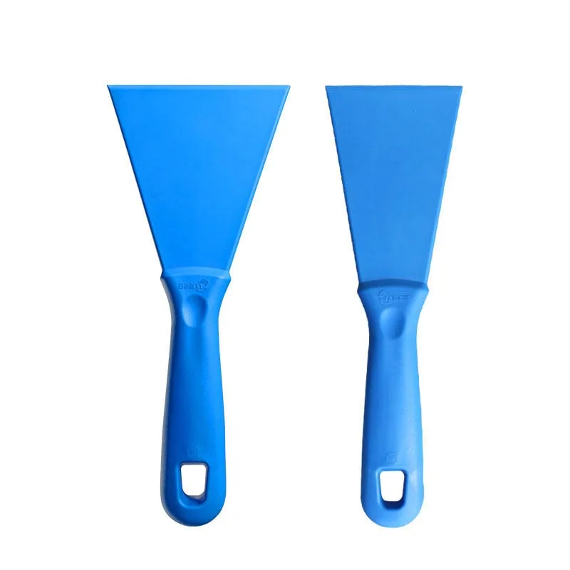 Plastic shovel, hand shovel, cleaning tool artifact, countertop, wall and floor, flat shovel for cleaning