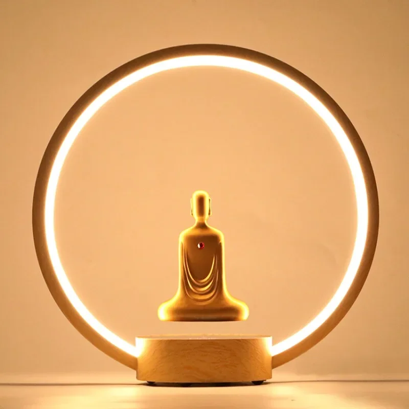 Magnetic levitation gold-plated faceless Buddha statue rotation LED luminous ring table lamp Zen meditation Buddha statue