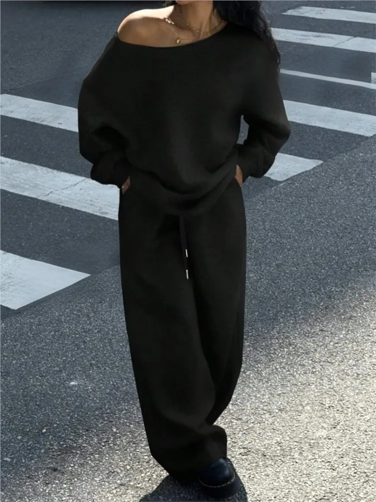 ชุดกางเกงสีพื้นสำหรับผู้หญิง ฤดูใบไม้ร่วงและฤดูหนาว สไตล์ลำลองแบบสปอร์ต เสื้อคอกลมทรงหลวม กางเกงขายาวทรงกว้าง ชุดสองชิ้น