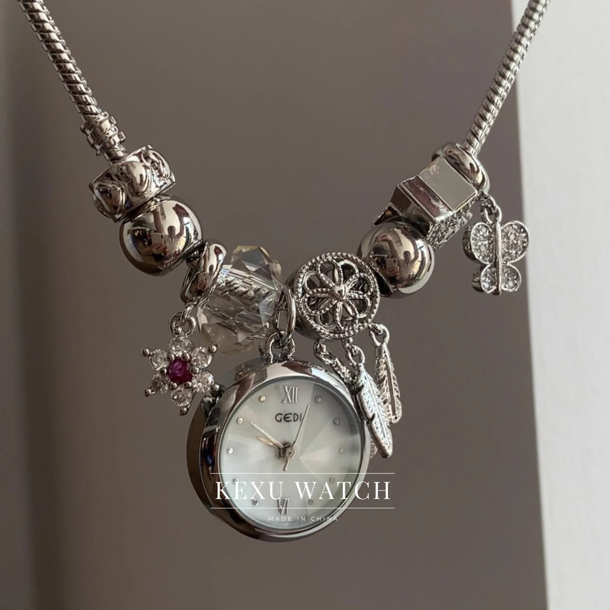 

GEDI Watch Handmade White Mother of Pearl Dial Charm Bracelet Watch, Elegant Dreamcatcher Accent Silver Bracelet Ladies Watch