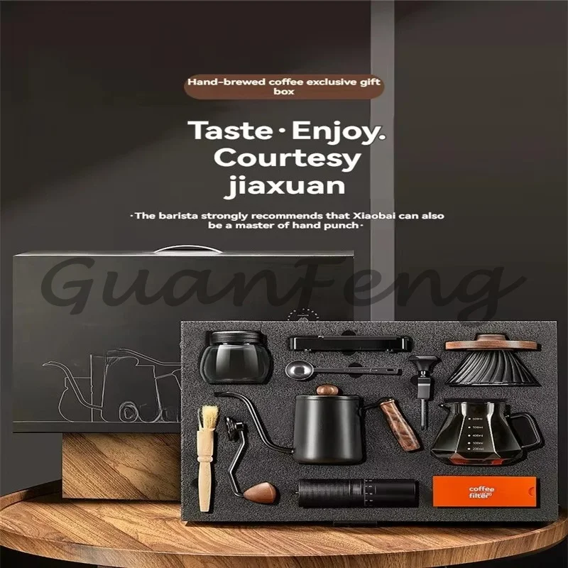 Outdoor hand-brewed coffee set with metallic glass poured over kettle and grinder