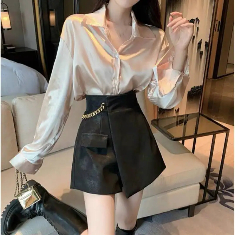 Irregular leather shorts women's autumn and winter design sense niche casual wide-leg pants slim Joker khaki skirt pants.