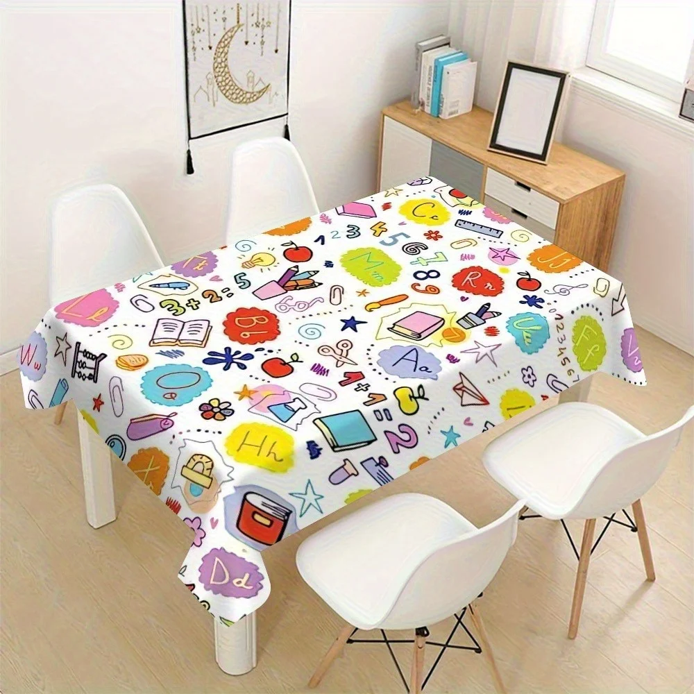 A back-to-school themed tablecloth with colorful letters and educational icons - made of polyester fabric