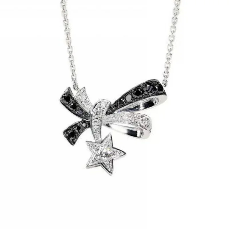 

Silver Plated Two-Tone Paved Bow & Star Pendant Necklace with Black & White Gemstone Detail