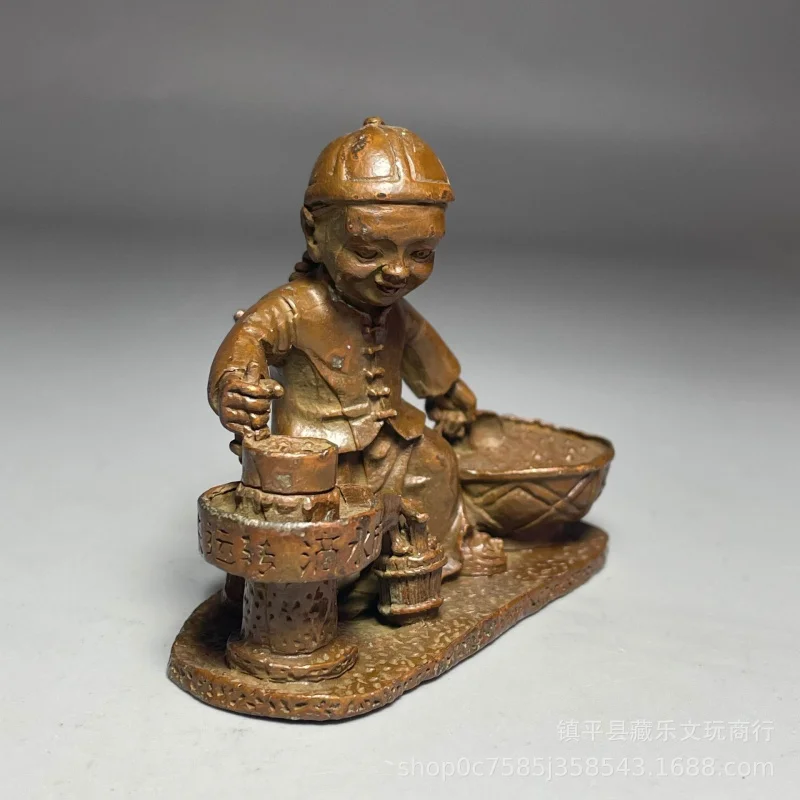 Antique collectible, aged bronze-colored alloy, "water turns to gold" boy pushing a stone mill, metal craft ornament