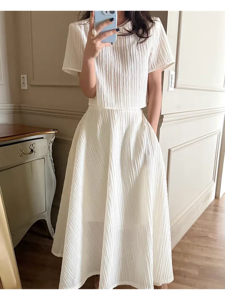 Women's Loose Fit Short Sleeve Top And High Waist Half Skirt Set with Back Button Hollow out Large Flounce 3D Texture