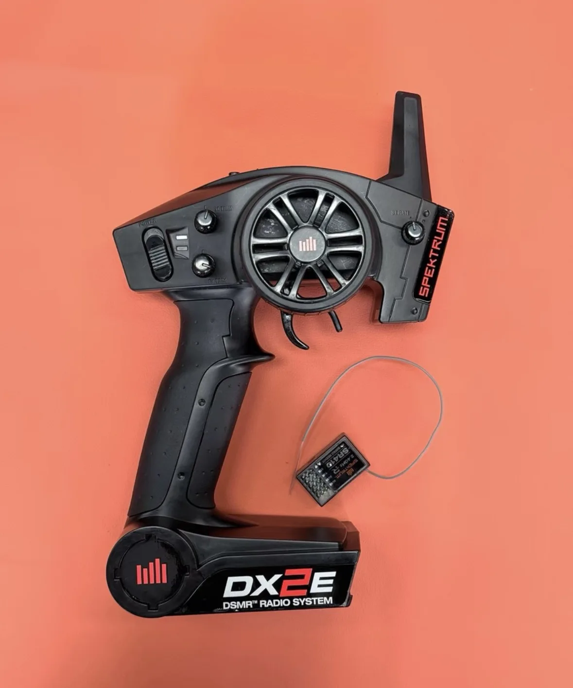 Used Spektrum DX2E DSMR 2.4GHz 2-Channel Radio transmitter and SR410 Receiver for RC sport-level car, truck and boat drivers