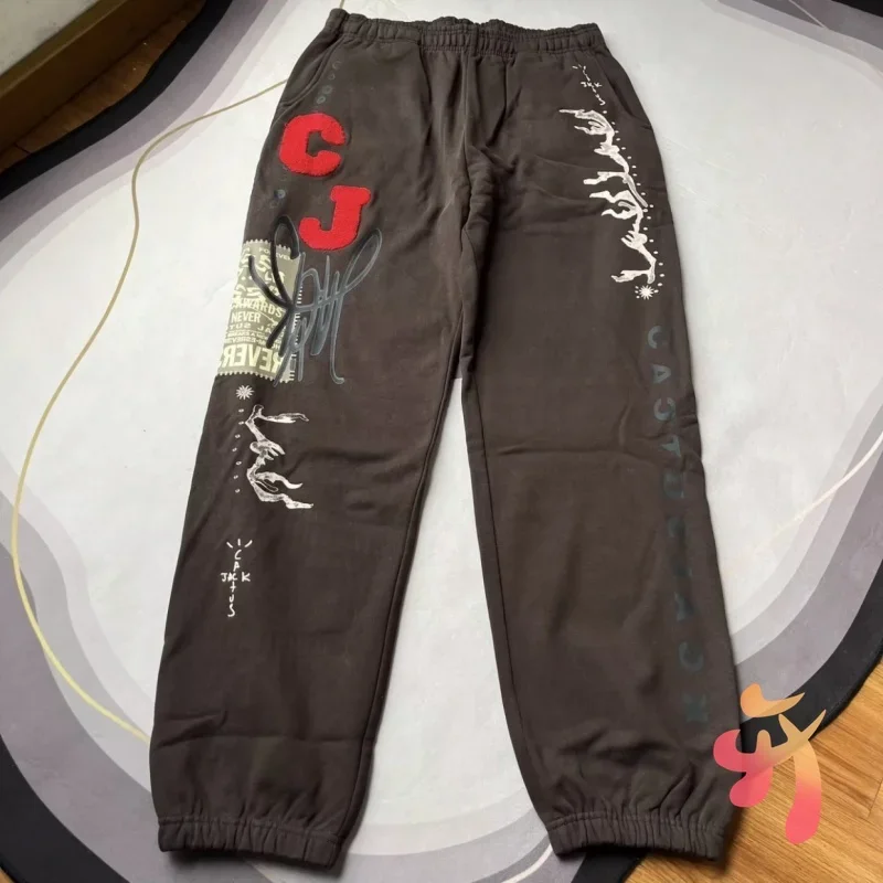 25ss Winter Fleece Cactus Jack Sweatpants High Quality Graffiti Letter Print Brown Drawstring Trousers Men Women Casual Joggers