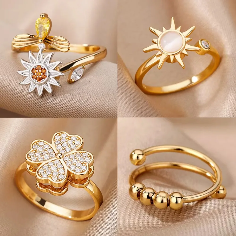 

4Pcs Rotatable Spinner Ring Set, Gold Plated Cubic Zirconia Four Leaf Clover Sunflower Open Band for Women