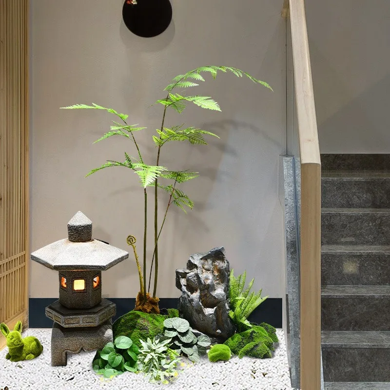 Decoration simulation under the stairs, green plants, rockery, small stones, landscape landscaping arrangement, indoor dry scene