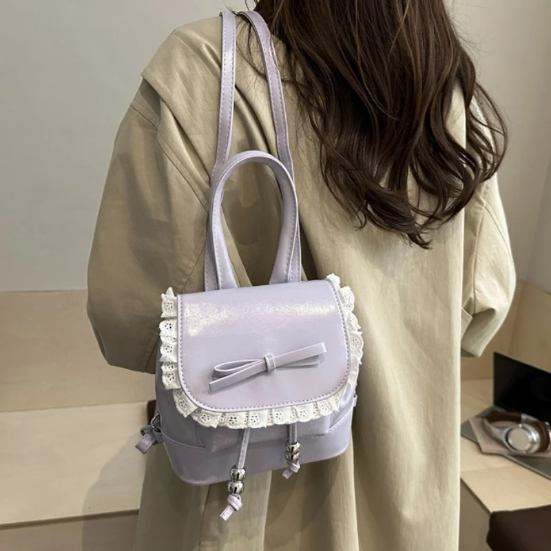 حقيبة ظهر نسائية كرتونية بسيطة للترفيه حقيبة مدرسية على طراز الباليه حقيبة دلو صغيرة مريحة ومتعددة الاستخدامات مع دانتيل على شكل فيونكة