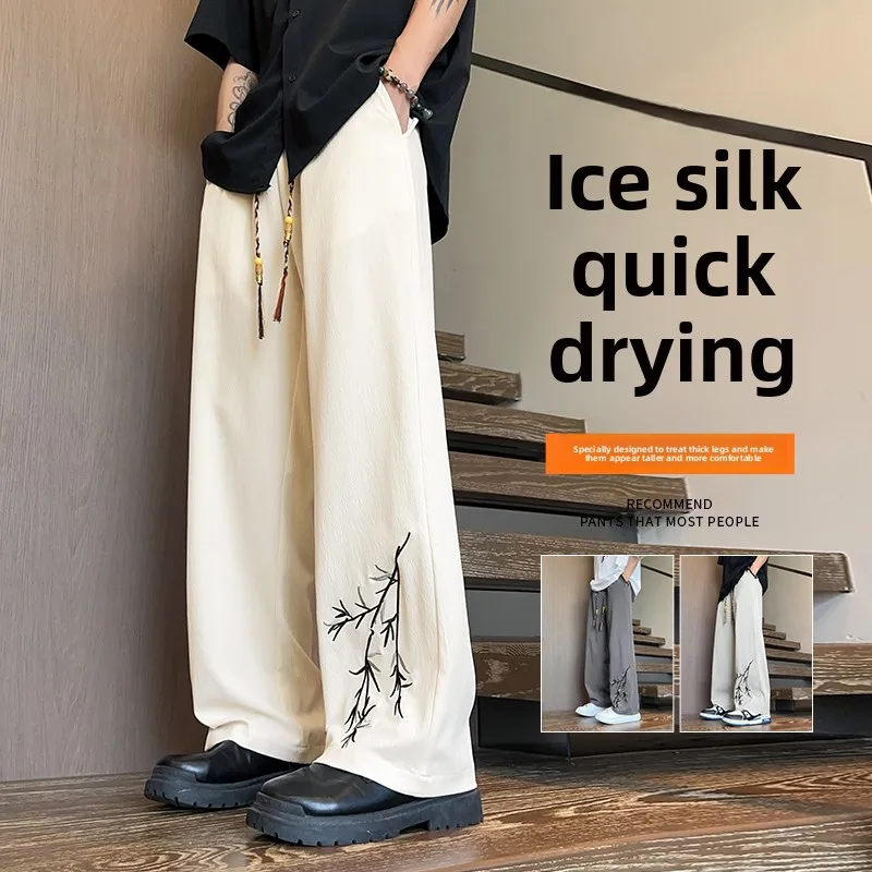 Nuevos pantalones chinos de seda de hielo para hombre, pantalones informales finos sueltos de pierna ancha de seda de hielo de marca a la moda de estilo chino con bordado fresco