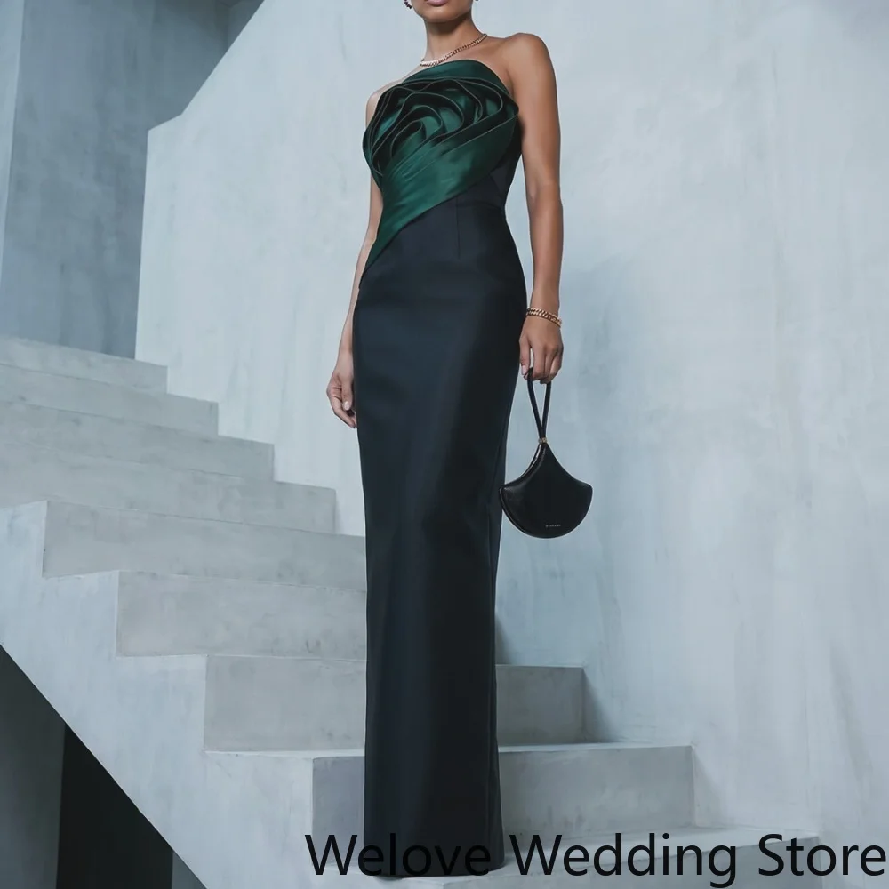 Sleek Black and Dark Green Formal Evening Gown featuring a modern strapless design an asymmetric satin bodice in rich dark green