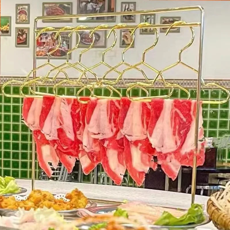 The hot pot restaurant has a sense of luxury hanging mutton and beef fillet hangers