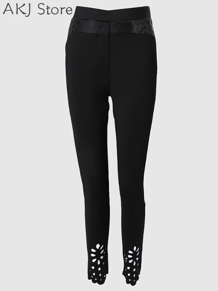Bloemen uitgeholde skinny broek met asymmetrische zoom en elastische taille
