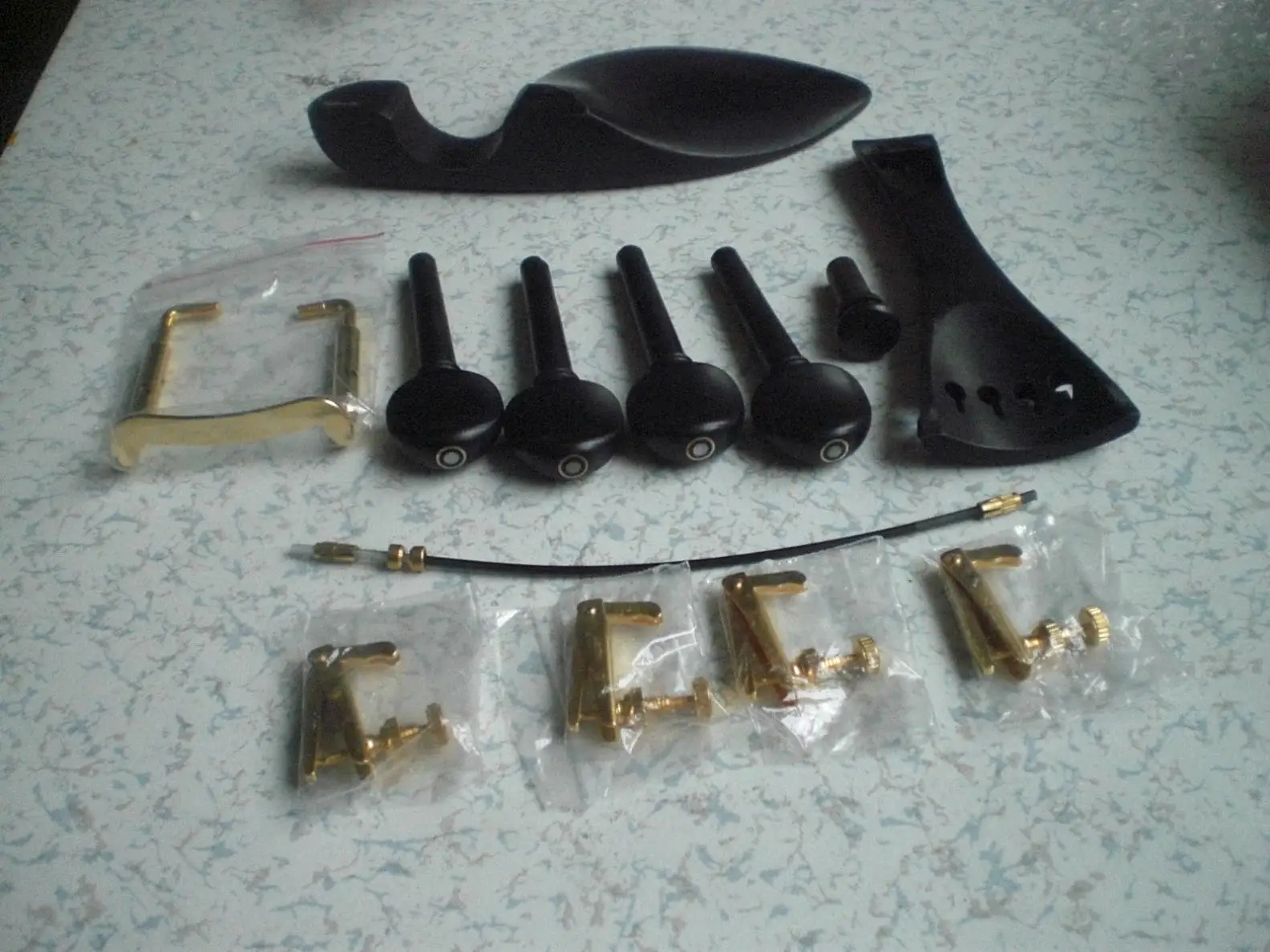 1 Set Ebony Violin Parts 4/4 With Parisian eye and  Gold Color Fine Tuners Chin Rest Clamp Nylon Gut