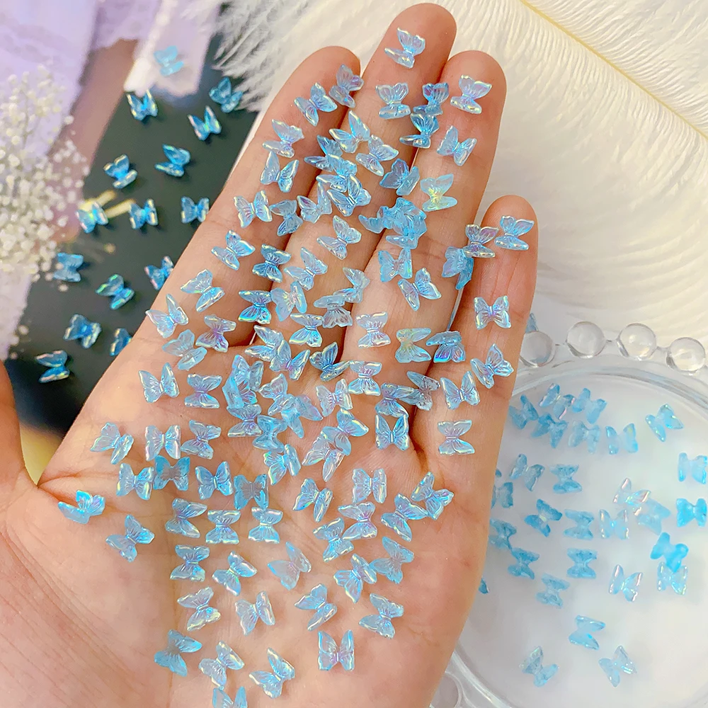 100 Uds 6*6mm 3D Aurora arco piezas de Arte de uñas encantos a granel brillante Mini resina mariposa uñas diamantes de imitación DIY Bowknot decoración de uñas #